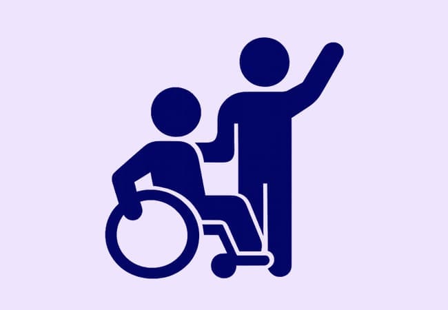 Dark blue icon of an Adviser Trainee sitting in a wheelchair beside another standing person with one arm raised, both on a light purple background.