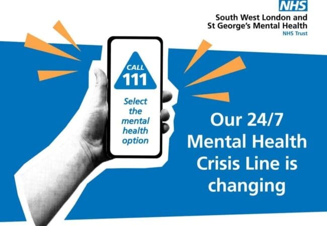 Hand holds a mobile showing Call 111, select the mental health option. NHS logo and text: South West London’s 24/7 Mental Health Crisis Line is changing to a New Number. Blue and orange graphic accents in the background.